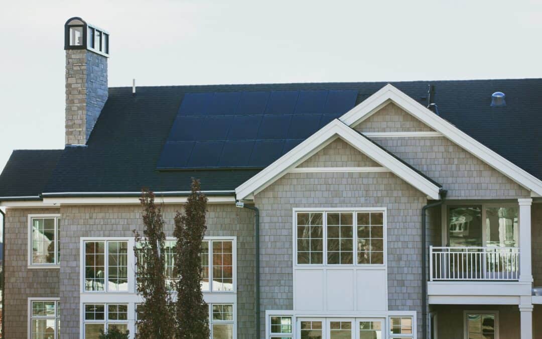 A large home with solar panels on the roof