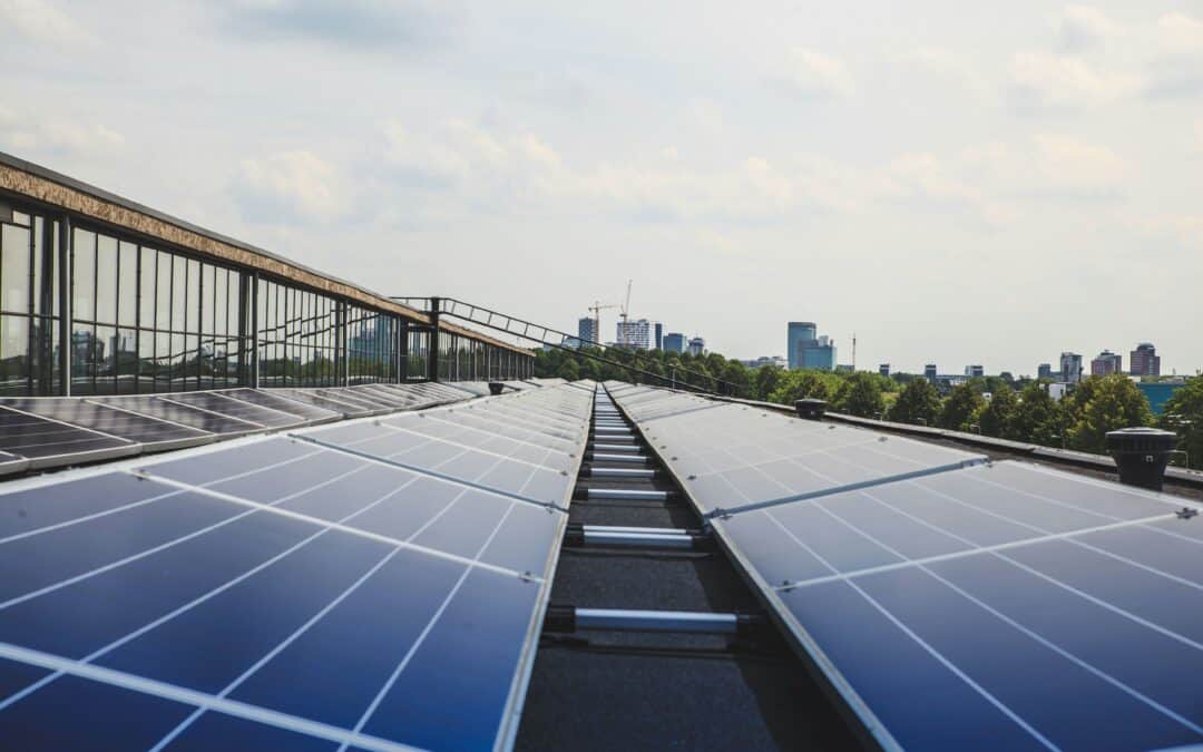 Solar panels on a roof overlooking a city